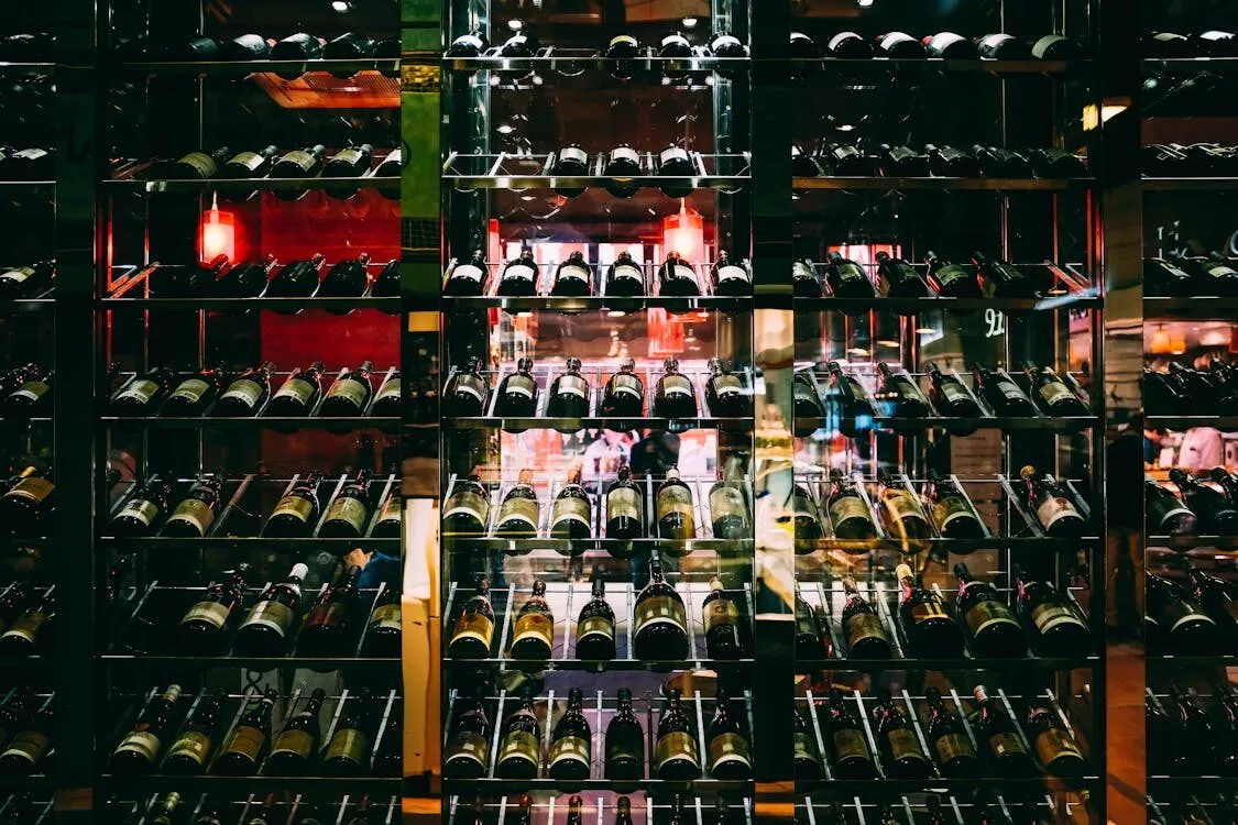 A climate controlled wine cellar with bottles in illuminated racks