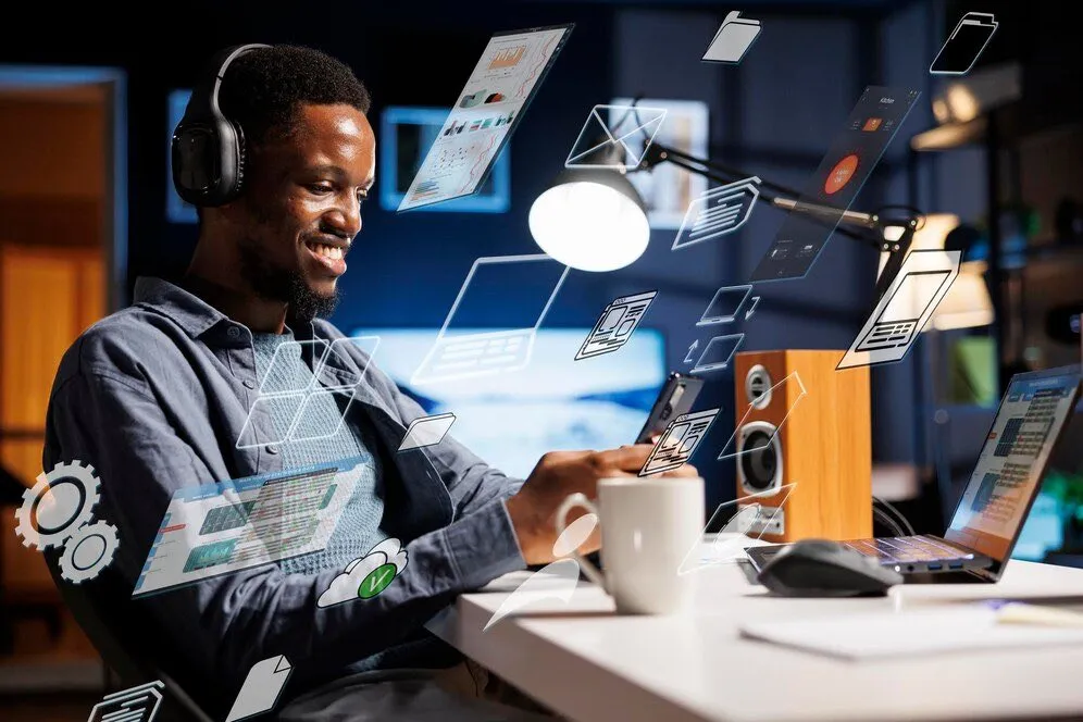 A man at a desk surrounded by floating illustrated app windows
