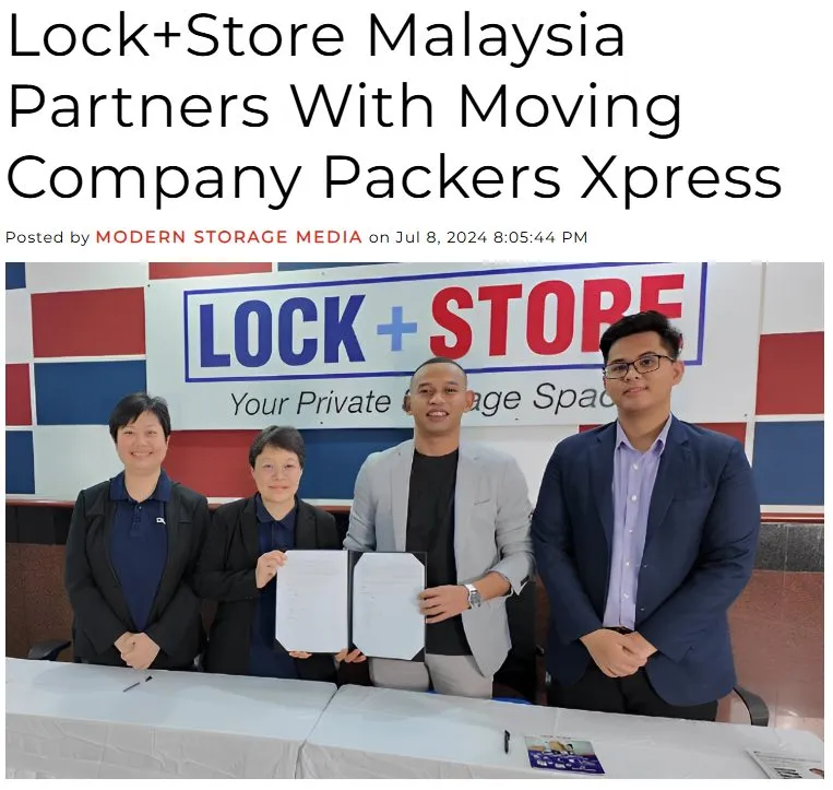 A trade press article about a storage brand partnering with a moving company, with representatives signing the agreement