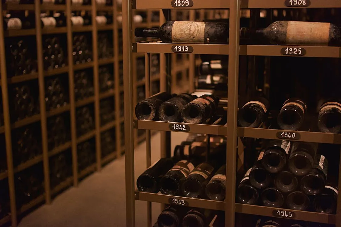 Numbered wooden racks holding individually stored wine bottles